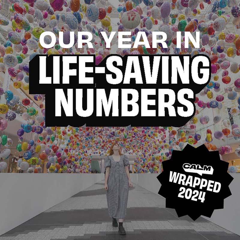 Text reads "OUR YEAR IN LIFE-SAVING NUMBERS" in bold white and black letters over a background of colourful balloons. A person in a grey dress walks beneath the balloons.